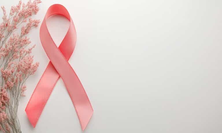 Pink Ribbon With Floral Arrangement Symbolizes Breast Cancer Awareness and Support Initiatives